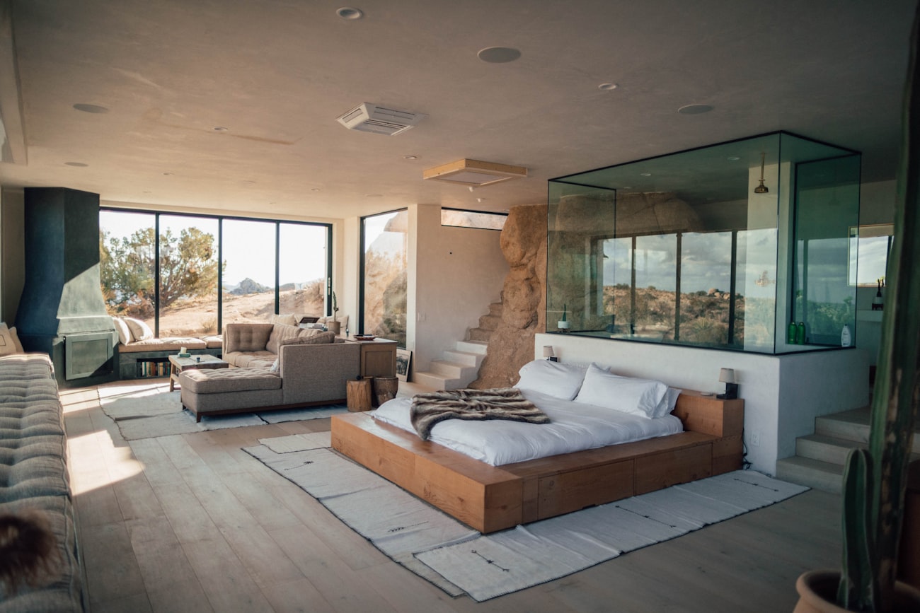 A calm desert house interior with warm wood and wide windows